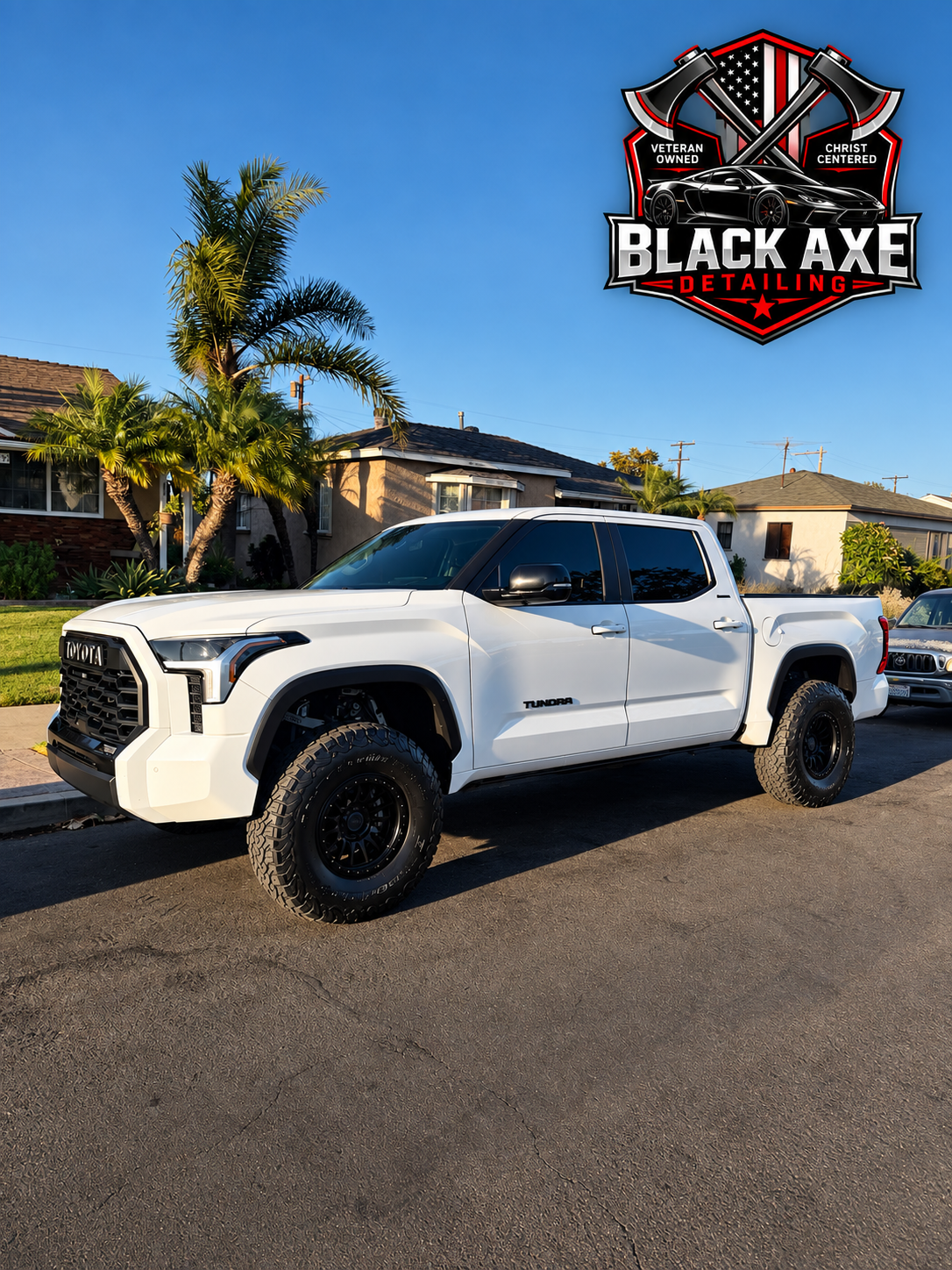 White Toyota Tundra with off-road wheels after a full detail
